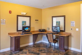 A room with two desks and chairs.